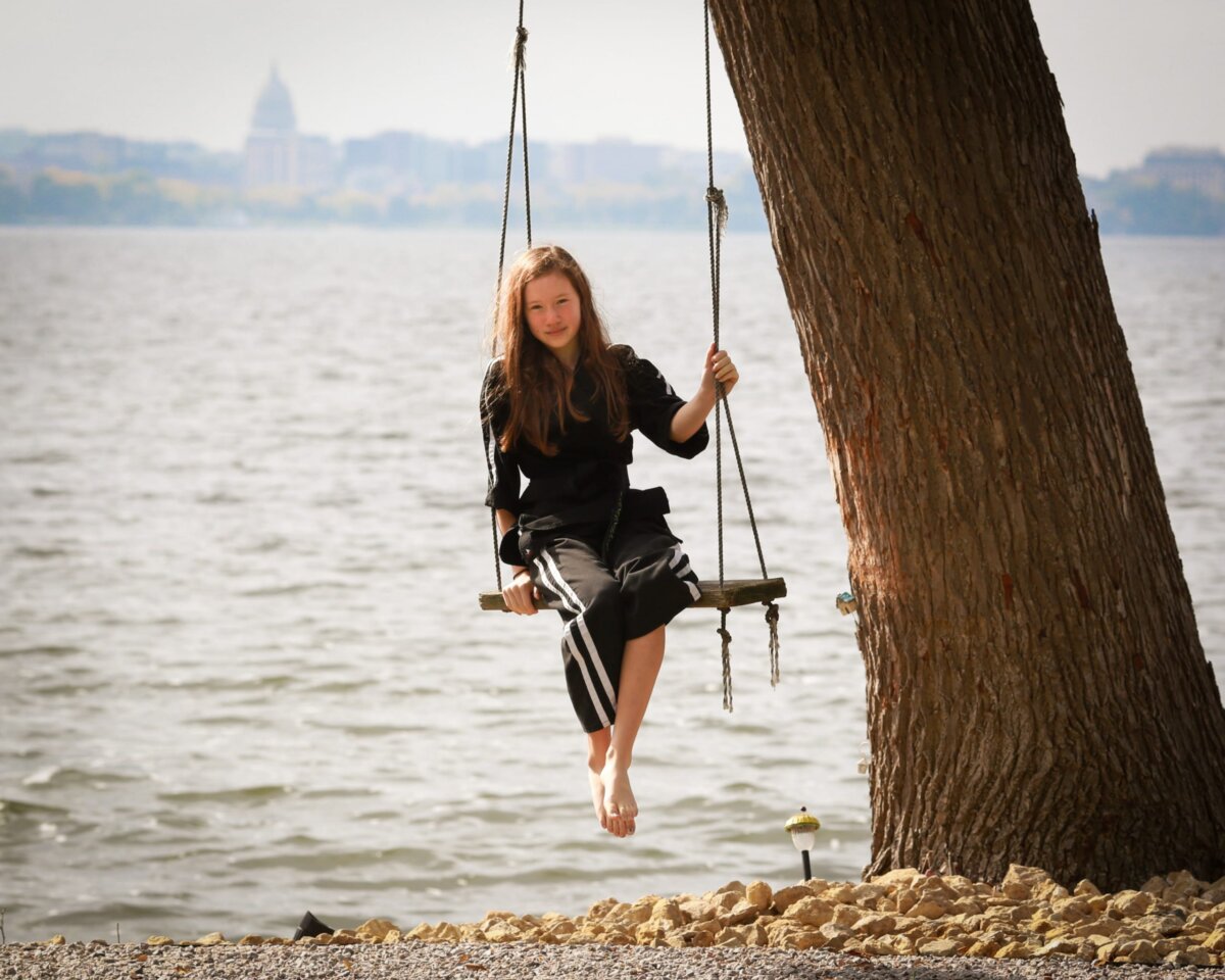 Child in a tree swing.