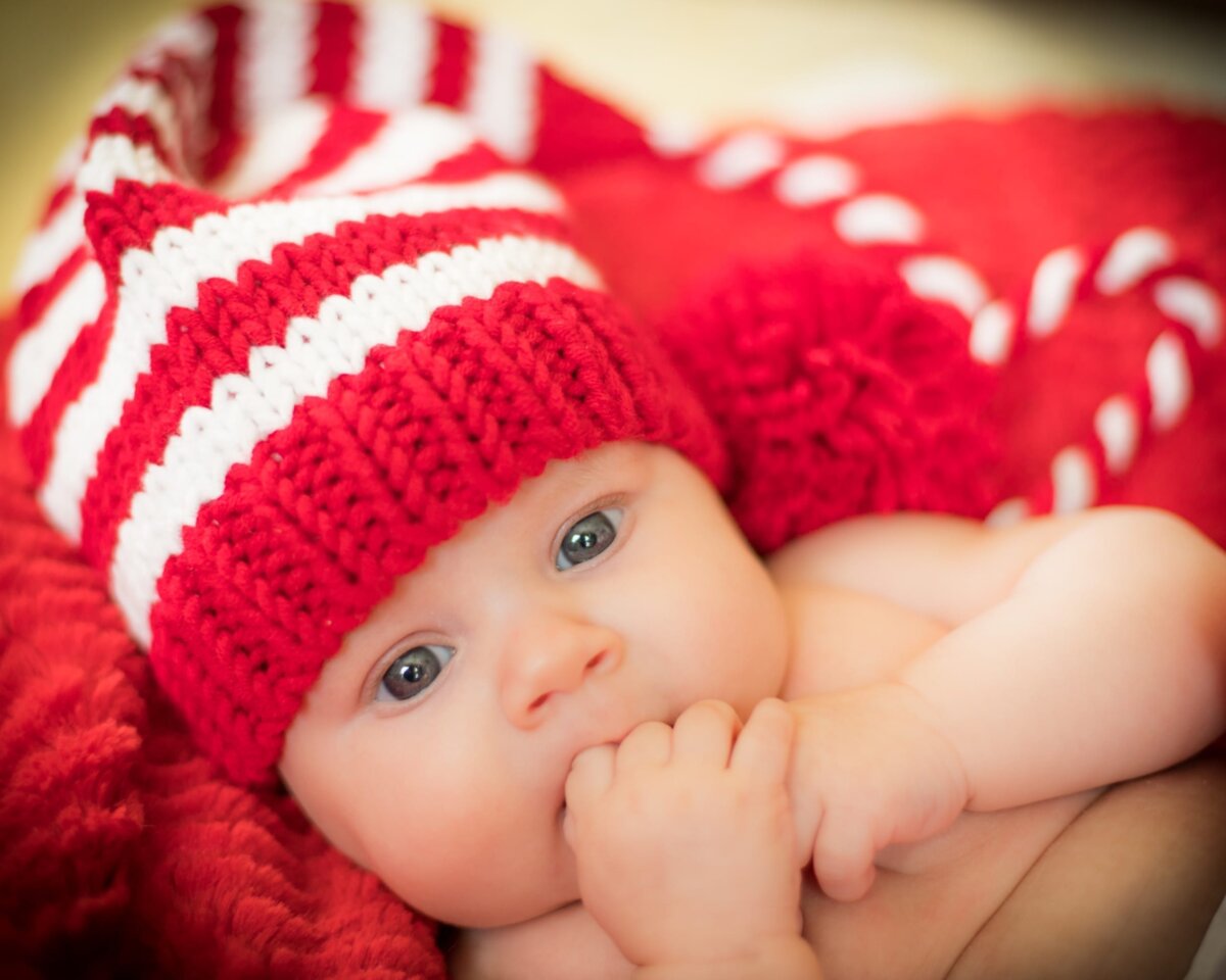 Baby in a red knit cap